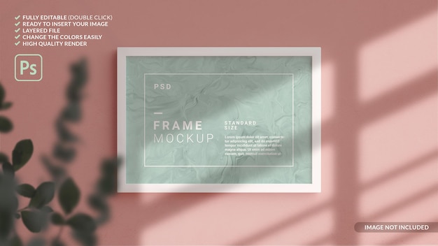 Horizontal photo frame mockup hanged in the wall in 3d rendering