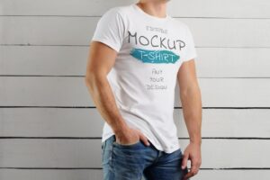 Mockup of a white t-shirt on a man on a wooden