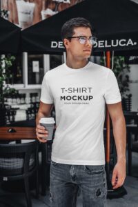 T-shirt mockup stylish man with coffee walking on street