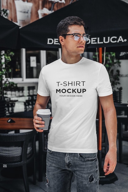 T-shirt mockup stylish man with coffee walking on street