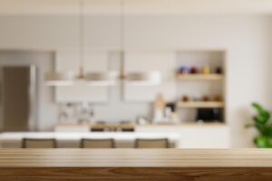 Wooden table top on blur kitchen room backgroundmodern contemporary kitchen room interior