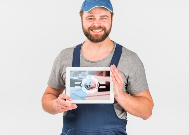 Worker holding tablet mockup for labor day