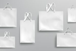 Paper shopping bags mockup, white packages with rope and lace handles, blank rectangular ecological gift packs, isolated mock up for branding and corporate identity design, realistic 3d set