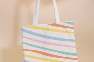 Tote bag mockup psd with pastel stripes pattern