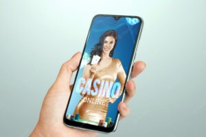 Beautiful girl with playing cards in her hand on the smartphone screen. online casino, gambling, betting, roulette. flyer, poster, template for advertising. copy space.