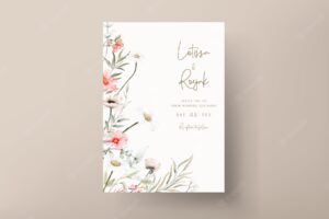 Beautiful watercolor wedding invitation card with elegant flower and tiny foliage