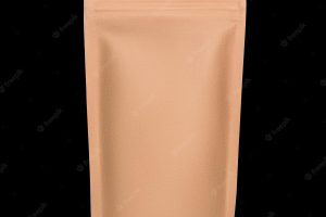 Blank brown kraft paper bag with zipper isolated on black background