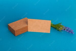 Cardboard business card mockup with flower