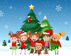 Children in christmas costumes with christmas tree