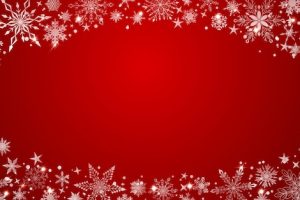Christmas background with various complex big and small snowflakes white on red arranged in a ellipse