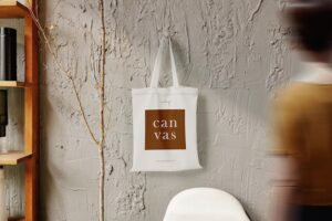 Clean minimal bag canvas hanging mockup on the wall with shelf and people walking blur foreground