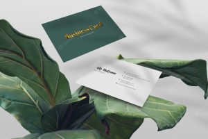 Clean minimal business card on leaf natural and tropical background logo mockup premium psd