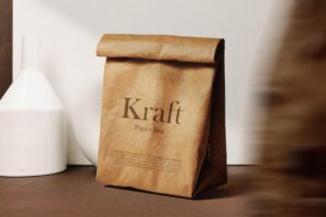 Clean minimal kraft paper bag mockup on background with object blur psd file
