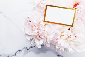 Glamorous business card or invitation mockup and bouquet of peony flowers wedding and event branding