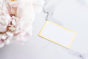 Glamorous business card or invitation mockup and bouquet of peony flowers wedding and event branding
