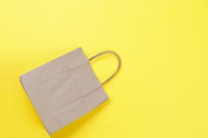 Kraft brown paper takeaway bag on yellow