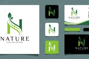 Letter n with leaf concepts with business card design template premium vector