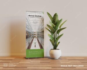 Roll up banner mockup in interior scene with a plant beside it