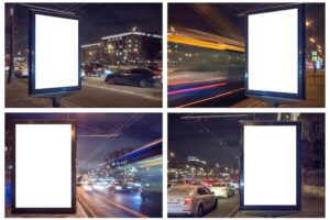Set of blank white lightbox at night. mock-up design. car lights in motion blur