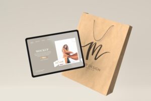 Shopping concept with tablet and paper bag