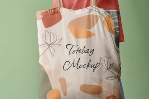 Side view of person holding tote bag mock-up