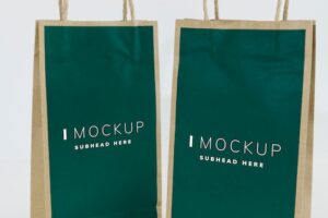 Two green paper bag mockups