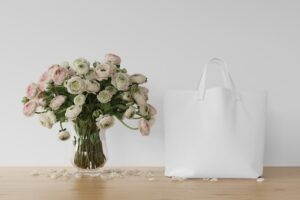 White bag and flowers in a vase