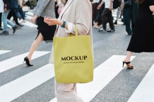 Woman with tote bag mockup in the city