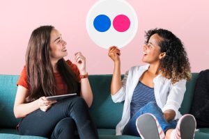 Women holding a flickr icon