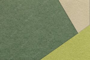 Texture of craft olive color paper background with beige and green border vintage abstract khaki cardboard