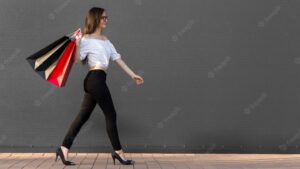 Woman and shopping bags copy space