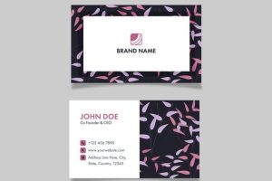Horizontal business card design with leaves pattern on gray background.