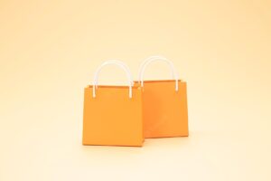 Minimal shopping bag package banner sign or symbol shopping concept orange background 3d rendering