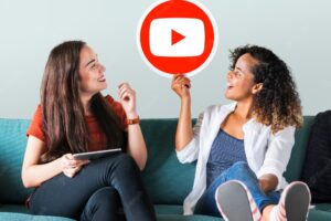 Women holding a youtube icon