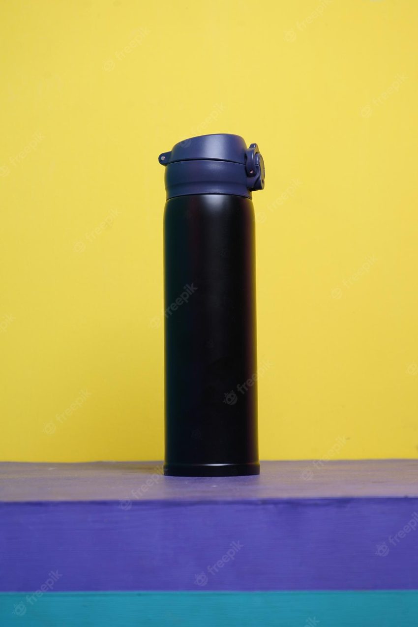 Black matte empty stainless thermo water bottle mock-up on colorful background.