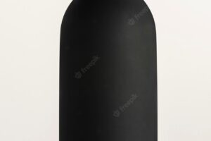 Black water bottle mockup on an off white background