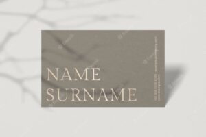 Blank business card on beige surface