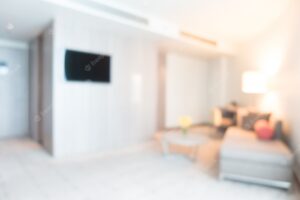 Blurred room with television and sofa