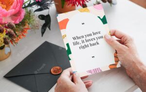 Card  with colorful ripped paper collage frame and motivational quote