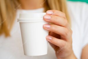 Close-up blonde woman with cup of coffee