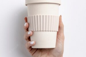 Close-up woman holding a coffee cup