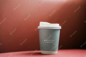 Coffee cup mockup in a red backdrop