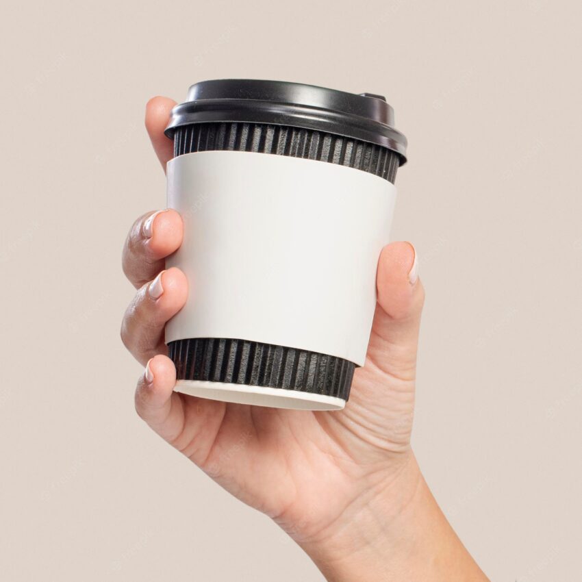 Coffee cup sleeve mockup psd held by woman