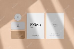 Corporate stationary set mockup with window shadow effect on a beige wall