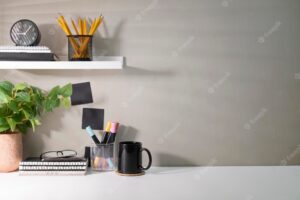 Creative workplace with supplies house plant and coffee cup on white table copy space for your advertise text