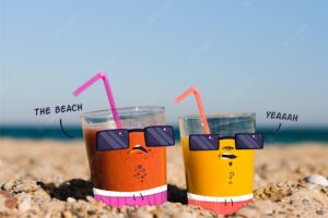 Doodle over juice glasses on beach
