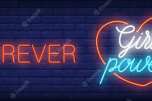 Forever girl power neon sign. luminous inscription in heart frame on brick wall.