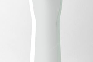 A front view white shampoo bottle with blue cap tube isolated on the white