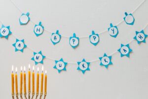 Hebrew menorah with sweets on a table