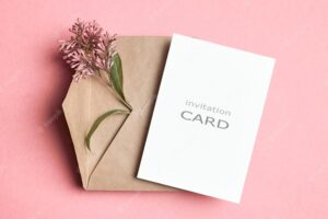 Invitation or greetong card mockup with envelope and flowers